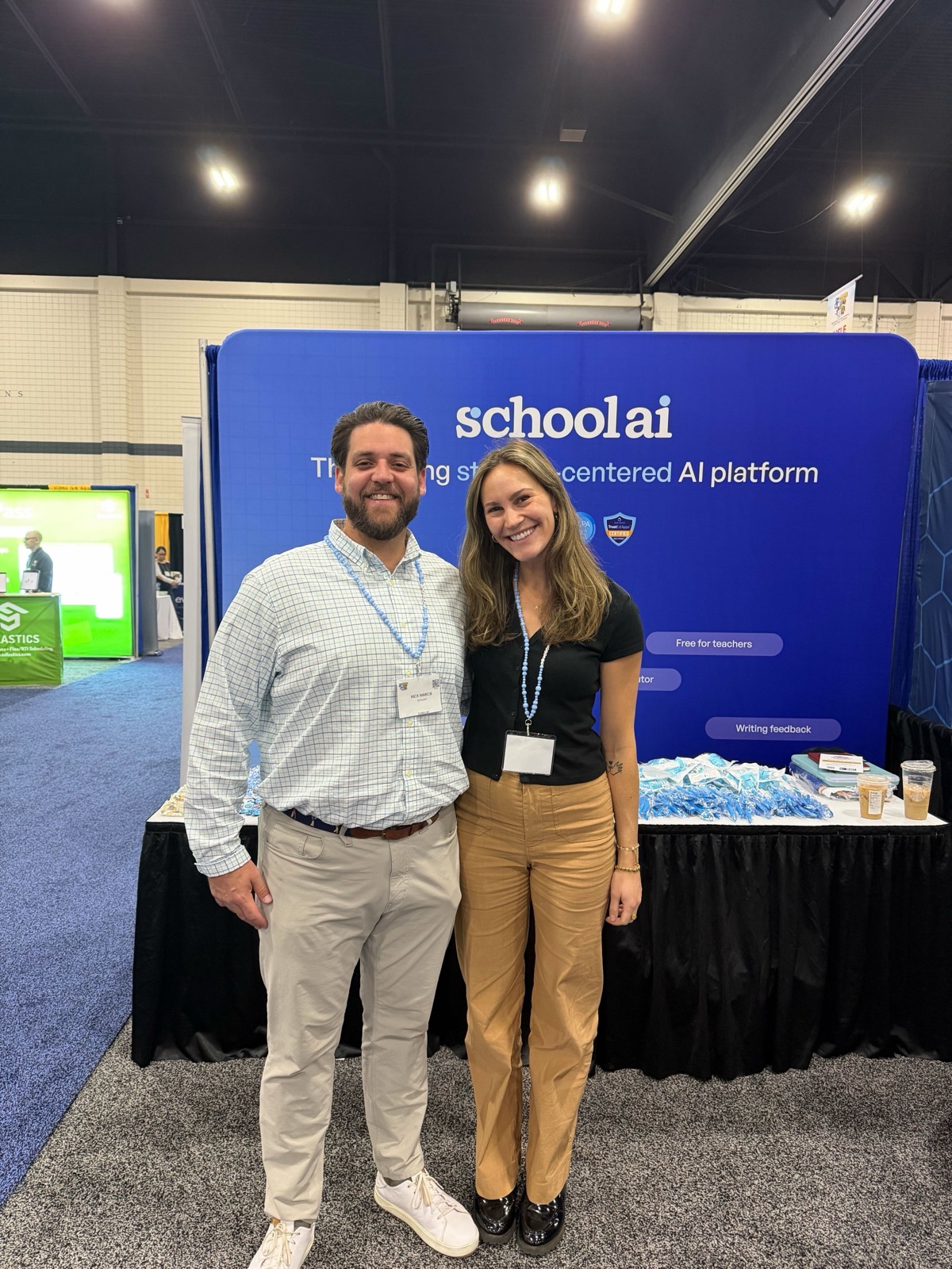 SchoolAI team at event booth